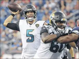  ?? STEVEN SENNE / AP ?? Quarterbac­k Blake Bortles (5) is enduring daily scrutiny as the Jaguars and their fans are running out of patience with the former No. 3 overall draft pick.