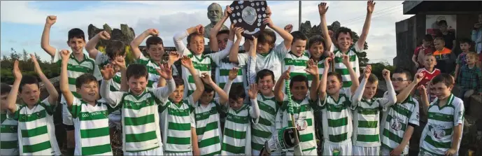  ??  ?? St Fechin’s celebrate their McCreesh Shield success.