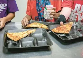  ?? ALBERTO MARIANI/AP 2022 ?? U.S. agricultur­e officials proposed new nutrition standards for school meals, including limits on added sugars and sodium. Reactions to the plan are mixed.