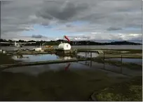  ?? ?? Concrete pads, and a fuel tank at Seaplane and Aero Adventures. Owner Aaron Singer said most alleged violations involve conditions that were caused by previous owners.