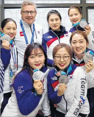  ?? SUBMITTED ?? South Korea’s Winter Olympics silver medal-winning women’s curling team of, front row from left, alternate Kim Cho-hi, second Kim Seon-yeong and lead Kim Yeong-mi, and back row from left, third Kim Kyeong-ae, coach and Charlottet­own native Peter...