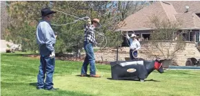  ?? 0FROEDERT HOSPITAL ?? Lyle and David Joyce roping at their house after Chuck’s transplant.