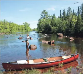  ?? PAUL A. SMITH / MILWAUKEE JOURNAL SENTINEL ?? Mike Bartz fishes on the St. Croix River near Minong. The Wisconsin Wildlife Federation is asking legislator­s to increase hunting and fishing license fees.