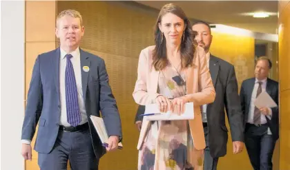  ?? Photo / Mark Mitchell ?? Covid-19 Response Minister Chris Hipkins and Prime Minister Jacinda Ardern arrive for the post-cabinet press conference yesterday.