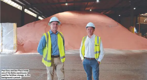  ?? ?? Paul Dury and Dan Place inside one of the Bohle warehouses used for fertiliser storage. In the background is potash.