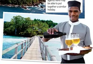  ??  ?? service with a smile: A waiter at the Bom Bom island resort