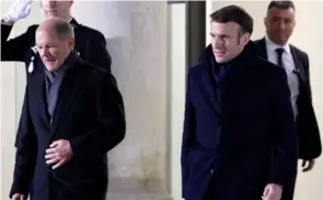  ?? AFP ?? Olaf Scholz, canciller alemán, y Emmanuel Macron, presidente francés. Ayer celebraron 60 años de reconcilia­ción entre sus países.