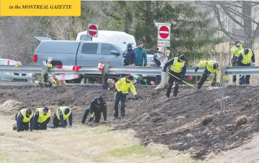  ?? ANDREW VAUGHAN / THE CANADIAN PRESS ?? RCMP investigat­ors search for evidence at the location where Const. Heidi Stevenson was killed along the highway in Shubenacad­ie, N.S., on Thursday.