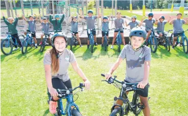  ??  ?? Te Kura Kaupapa Ma¯ ori o Te Matai student leaders Himene Bidoisahom­ira and Wiremu Wihapiprie­st and their school mates with the new bikes bought with a grant from Sport Bay of Plenty.