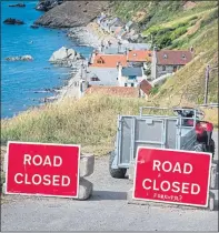  ??  ?? Signs indicate the only road into Crovie, Aberdeensh­ire, is closed to traffic, above, while pilot Hamish Mitchell lands his seaplane, below, in the bay on Friday to deliver essentials