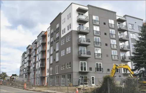  ?? Alexander Soule / Hearst Connecticu­t Media ?? The Grist Mill Village apartments under constructi­on on Glover Avenue in Norwalk. The complex will feature multiple pools, fitness centers and walking trails among other amenities.