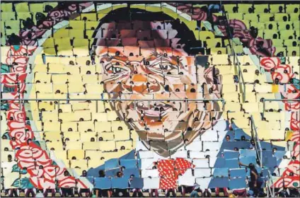  ??  ?? High hopes: People use boards to make a portrait of President Emmerson Mnangagwa at Independen­ce Day celebratio­ns. Zanu-PF’s manifesto, launched by Mnangagwa, has a laundry list of issues the party promises to address. Photo: Jekesai Njikizana/AFP