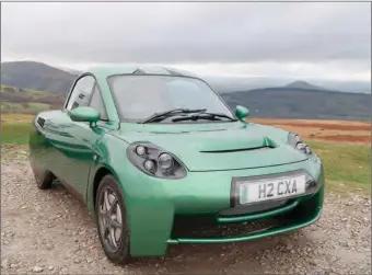  ?? (IMAGES: GEOFF CADDICK/AFP) ?? A Rasa hydrogen-powered car is pictured in Llandgynid­r, near Brecon in Wales.