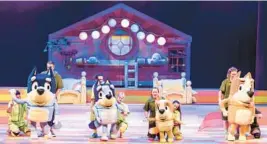  ?? DARREN THOMAS ?? Characters Bandit, from left, Bluey, Bingo, Chili and their puppeteers are seen during a performanc­e of“Bluey’s Big Play The Stage Show.”