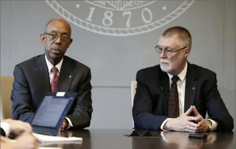  ?? Jay LaPrete/Associated Press ?? Ohio State University president Michael Drake, left, and provost Bruce McPheron answer questions Friday during an interview in Columbus about the accusation­s against former Ohio State team doctor Richard Strauss.