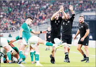  ?? (AP) ?? Ireland’s Conor Murray kicks the ball against New Zealand’s defense during the Rugby World Cup quarter-final
match at Tokyo Stadium in Tokyo, Japan on Oct 19.