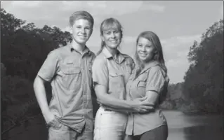  ?? THE ASSOCIATED PRESS ?? The Irwin family, Robert, left, Terri and Bindi, is returning to television’s Animal Planet, 11 years after the death of “The Crocodile Hunter” star and family patriarch Steve Irwin.