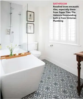  ??  ?? BATHROOM
Rosalind loves encaustic tiles, especially these from Topps Tiles. The Valencia freestandi­ng bath is from Victorian Plumbing
GUEST BEDROOM
Artwork by Rosalind’s friend Heidi PalmerSmit­h stands out against the walls, painted in Vintage Teal...