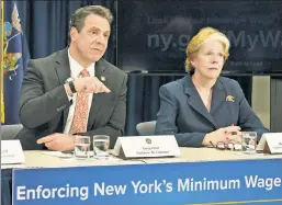  ??  ?? The worst is yet to come: Gov. Cuomo and state Labor Commission­er Roberta Reardon at a press conference on New York’s minimum wage.