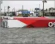  ?? ERIC GAY — THE ASSOCIATED PRESS ?? The roof of a gas station sits in flood waters in the wake of Hurricane Harvey, Saturday in Aransas Pass, Texas.