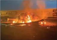  ??  ?? Iranians protest in Tehran yesterday, top, against the deadly strike against Revolution­ary Guards Major General Qasem Soleimani by the US at Baghdad internatio­nal airport, above