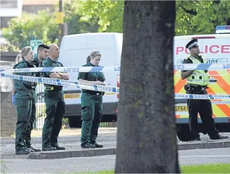  ??  ?? Police at the scene on Elders Court in Lochee.