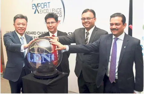  ??  ?? All for one: (From left) Star Media Group group managing director and CEO Datuk Seri Wong Chun Wai, Matrade CEO Dr Mohd Shahreen Zainoreen Madros, Isham and Standard Chartered Bank Malaysia managing director and CEO Abrar Anwar during the Export Excellence Awards launch at Mitec.