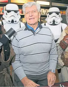  ??  ?? SAFETY FIRST: Dave Prowse promoting his book Straight From The Force’s Mouth with a couple of stormtroop­ers.