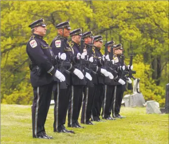  ?? Rob Ryser / Hearst Connecticu­t Media ?? George Johnson, a retired Danbury Police Department captain, was buried with full honors on Monday, including a 21-gun salute at Wooster Cemetery in Danbury.