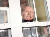  ?? SUSIE KOCKERSCHE­IDT TORSTAR FILE PHOTO ?? A resident of a long-term care home in Keswick looks out his window. Margaret Shkimba argues it’s time for a national strategy on caring for our elderly.