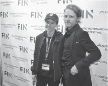  ??  ?? Nova Scotia-born actor and activist Elliot Page, left, announced Tuesday that he is transgende­r and non-binary. Seen here at the 2019 FIN Atlantic Internatio­nal Film Festival with There's Something in the Water co-director Ian Daniel, the Academy Award-nominated star of Juno and the Netflix hit The Umbella Academy made the announceme­nt on his Twitter and Instagram accounts.