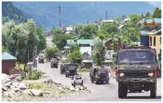  ?? FILE PHOTO:PTI ?? An army convoy moves along the Srinagar-leh highway on Wednesday, after Indian soldiers had a violent standoff with Chinese troops in eastern Ladakh