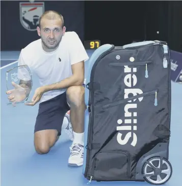  ??  ?? 0 Dan Evans with the Battle of the Brits trophy after his final victory over Kyle Edmund yesterday.