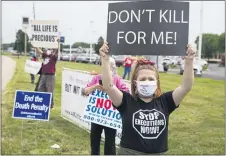  ?? MICHAEL CONROY — THE ASSOCIATED PRESS ?? Protesters against the death penalty gather in Terre Haute, Ind., Wednesday, July 15, 2020. Wesley Ira Purkey, convicted of a gruesome 1998 kidnapping and killing, was scheduled to be executed Wednesday evening at the federal prison in Terre Haute.