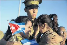  ?? Alejandro Ernesto European Presssphot­o Agency ?? CUBAN military personnel mourn in Havana. “If it wasn’t for El Comandante Castro, my life would never have changed,” said one woman in Matanzas.