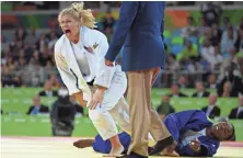  ?? KYLE TERADA, USA TODAY SPORTS ?? Kayla Harrison, left, who beat Audrey Tcheumeo for the gold medal, could have a future in mixed martial arts.