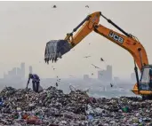  ?? — PTI ?? A ragpicker collects reusable items at a dumping site at Ghazipur in New Delhi on the eve of World Environmen­t Day, observed every year on June 5. The theme of this year is 'Air Pollution'.