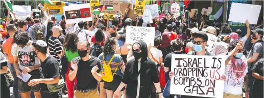  ?? (Carlo Allegri/Reuters) ?? PROTESTERS, MANY of them Jewish, demonstrat­e against Israel across the street from the Israeli Consulate in New York last May.