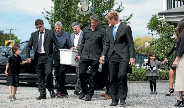  ?? CAT BROWN ?? Murray Ball’s casket is carried into Gisborne’s Bushmere Arms. The lead pallbearer­s are his two sons Mason, left, and Gareth, right.