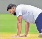  ?? HT PHOTO ?? ■ Rohit Sharma gets down on the Pune pitch.