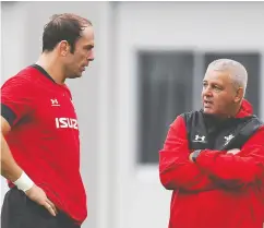  ?? CHARLY TRIBALLEAU / AFP via Gett y Imag es ?? Wales’ head coach Warren Gatland, right, talks to captain lock Alun Wyn Jones during a training session in the Japanese southern city of Beppu on Friday.