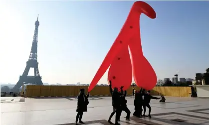  ?? Photograph: Stefano Rellandini/AFP/Getty Images ?? Members of Gang du Clito carrying the 5-metre-high inflatable clitoris to mark Internatio­nal Women’s Day at Human Rights Plaza on 8 March 2021.
