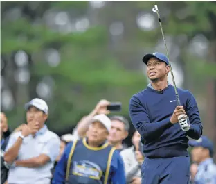  ?? MATT ROBERT • USA TODAY FILE PHOTO ?? Tiger Woods led the way as the United States dominated the Sunday singles to overhaul the Internatio­nals at Royal Melbourne 16-14 and claim an eighth successive Presidents Cup.