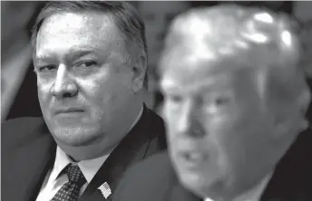  ?? Tribune News Service ?? ■ Secretary of State Mike Pompeo, left, listens to President Donald Trump speak during a Cabinet meeting in the Cabinet Room of the White House on July 18 in Washington, D.C.