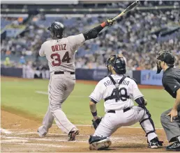  ??  ?? JUICE BOX: Tampa’s Tropicana Field has been home to some of the Red Sox’ biggest moments of the past 20 years, from Gerald Williams fighting Pedro Martinez, far left, to David Ortiz belting his 500th home run, left.