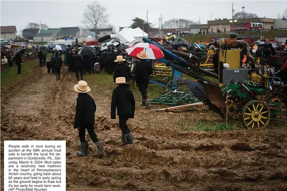  ?? (AP Photo/Matt Rourke) ?? People walk in mud during an auction at the 56th annual mud sale to benefit the local fire department in Gordonvill­e, Pa., Saturday, March 9, 2024. Mud sales are a relatively new tradition in the heart of Pennsylvan­ia's Amish country, going back about 60 years and held in early spring as the ground begins to thaw but it's too early for much farm work.