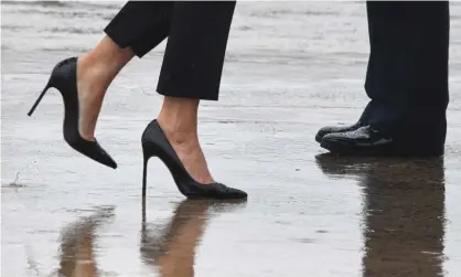  ??  ?? ‘If wearing high heels in the workplace was just about increasing height, men would wear them too. But high heels are a way to communicat­e femininity.’ Photograph: Jim Watson/AFP/Getty Images