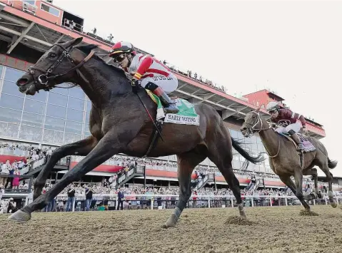  ?? Rob Carr/Getty Images ?? Jose Ortiz stalked behind the leaders for much of the race before riding Early Voting to victory over Joel Rosario and Epicenter in Saturday’s second leg of the Triple Crown. Early Voting crossed the finish line in 1:54.54 and paid $13.40, $4.60 and $3.60.