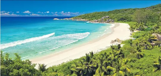  ?? MALBERT/FOTOLIA ?? Thick vegetation surrounds the Grand Anse beach on La Digue, a short bicycle ride away from the writer’s guest house.