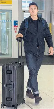  ??  ?? ON THE CASE: Erik Sviatchenk­o preparing to jet off to join Celtic training in the Dubai sun.